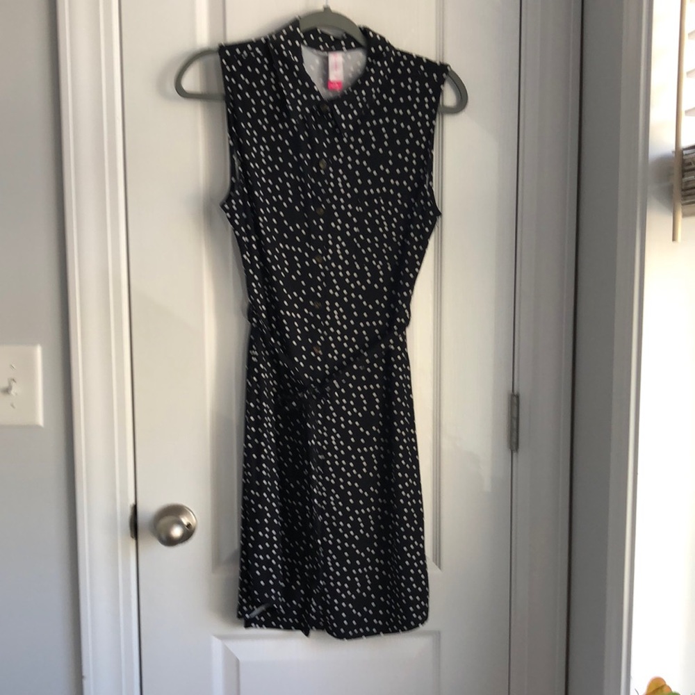 Black and white polka dot, sleeveless dress.